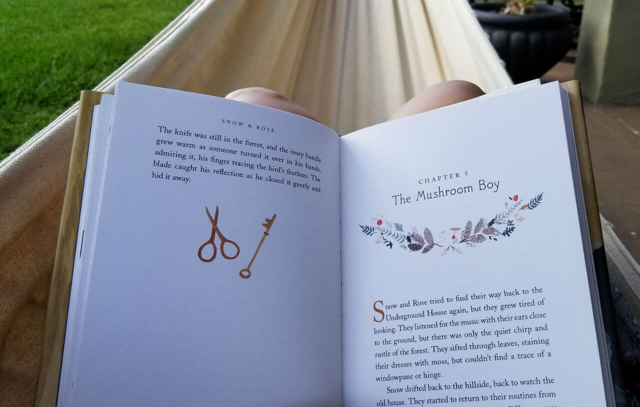 Snow & Rose opened on a woman's lap