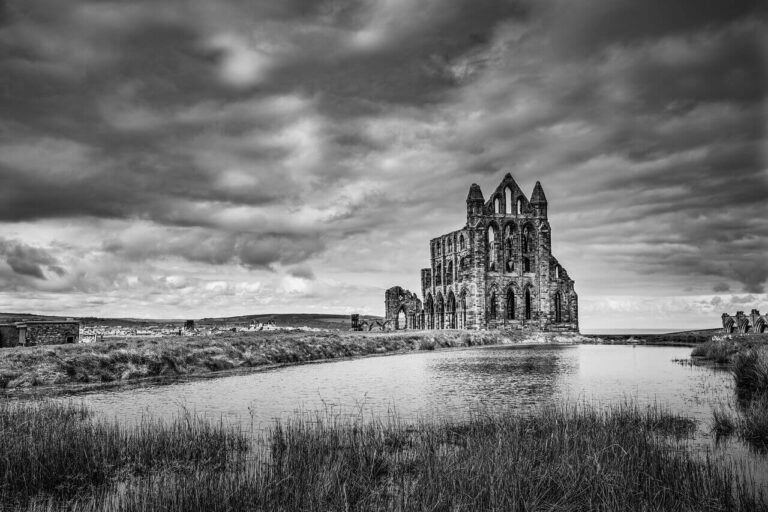 black and white image of a spooky looking ruined church in the lowlands